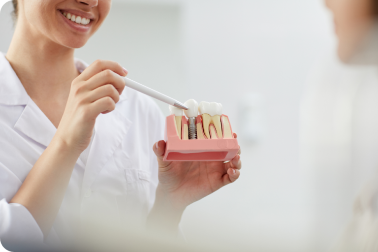 smiling dentist explaining tooth implantation NUX947L